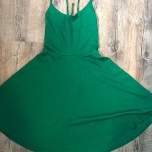Green dress. Open tie back.